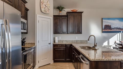 Fully stocked gourmet kitchen with granite countertops