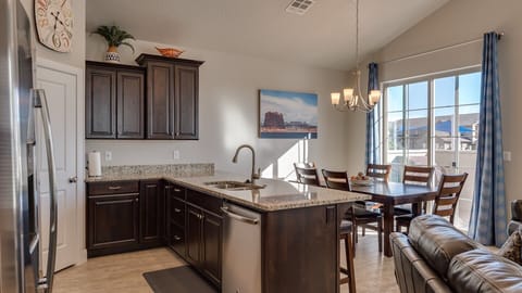 Fully stocked gourmet kitchen with stainless steel appliances