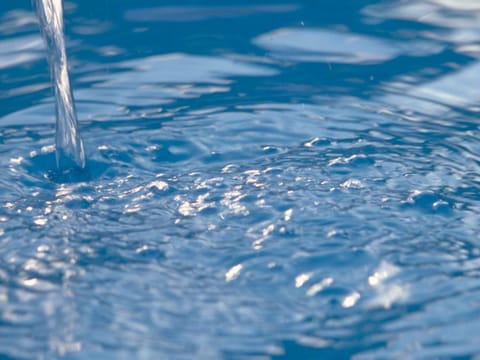 Seasonal outdoor pool, open 10:00 AM to 8:00 PM, pool umbrellas