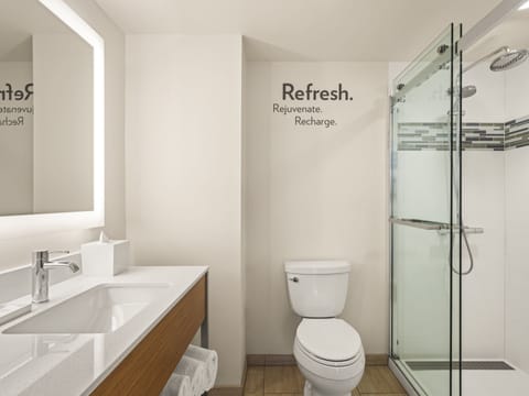 Designer toiletries, hair dryer, towels