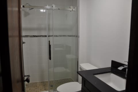 Luxury Suite, 1 King Bed, Balcony | Bathroom amenities | Shower, rainfall showerhead, free toiletries, hair dryer