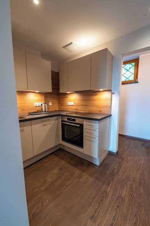 Fridge, highchair, cleaning supplies