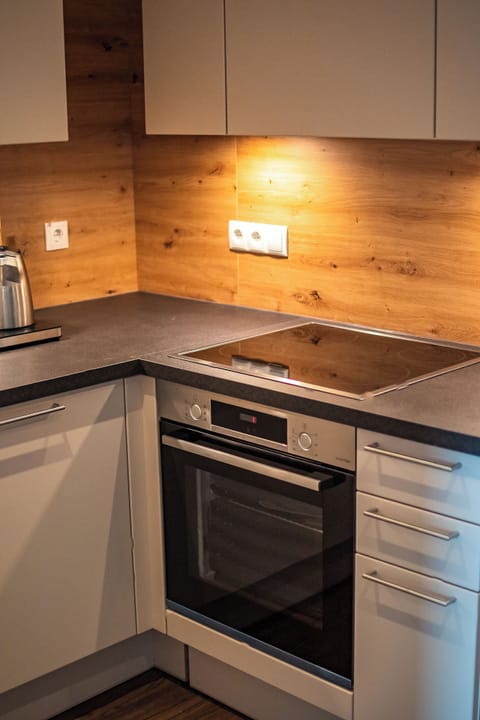 Family Triple Room | Private kitchen | Fridge, highchair, cleaning supplies