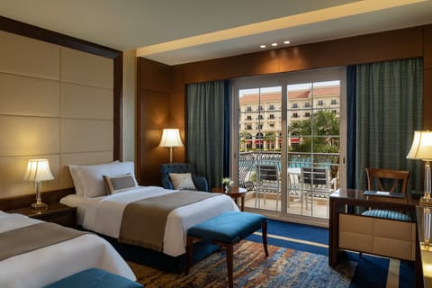 Deluxe Room, 2 Twin Beds, Balcony, Pool View | Minibar, in-room safe, desk, laptop workspace