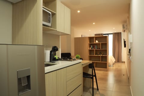 Junior Suite Single Occupant | Private kitchen | Fridge, microwave, stovetop, coffee/tea maker