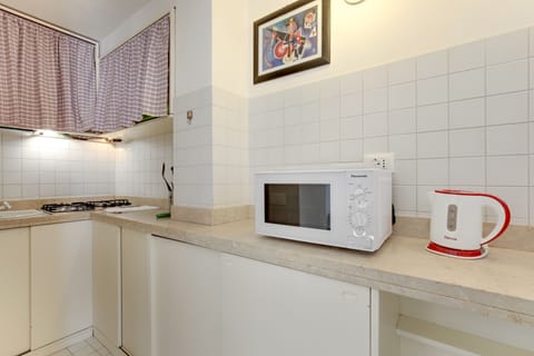 Apartment, 1 Bedroom | Private kitchenette | Full-size fridge, microwave, stovetop, coffee/tea maker