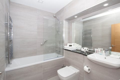 Combined shower/tub, deep soaking tub, designer toiletries, hair dryer