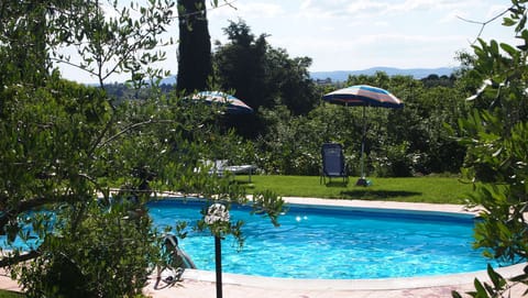 Seasonal outdoor pool, open 9:00 AM to 8:00 PM, pool umbrellas