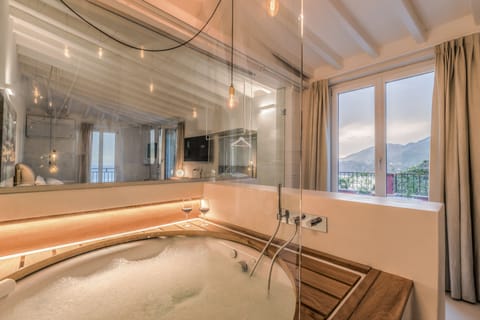 Honeymoon Suite, Jetted Tub | Bathroom | Designer toiletries, hair dryer, bathrobes, slippers