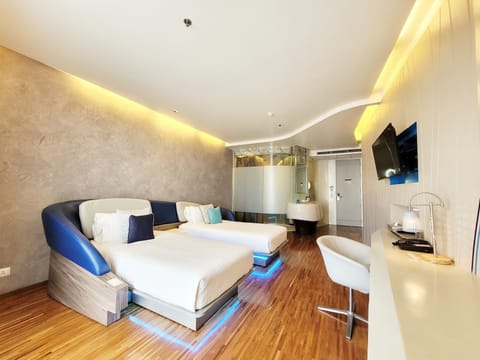 Deluxe Twin Room, Balcony | Living area | 48-inch LCD TV with cable channels, TV, DVD player