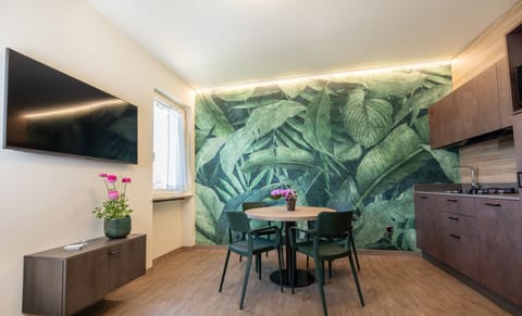 Deluxe Apartment | Living area | 42-inch Smart TV with satellite channels