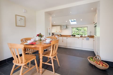 Garden Cottage, Teviot Bank - kitchen and dining area with seating for four guests