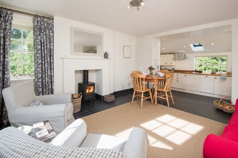 Garden Cottage, Teviot Bank - open-plan living area and kitchen with wood burning stove and dining space for four guests