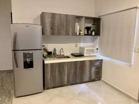 Luxury Suite, 1 King Bed with Sofa bed, Balcony, City View | Private kitchen | Full-size fridge, microwave, stovetop, coffee/tea maker