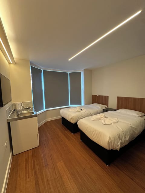Twin Room | Laptop workspace, iron/ironing board, free WiFi, bed sheets