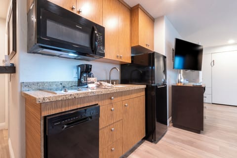 Junior Suite, 1 Bedroom | Private kitchen | Fridge, microwave, stovetop, dishwasher