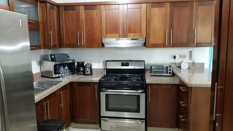 Apartment, 3 Bedrooms | Private kitchen | Fridge, microwave, oven, stovetop