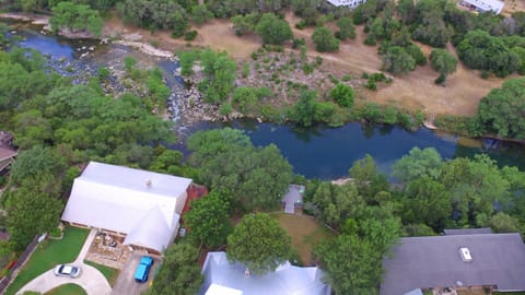 Aerial view - home + deck, no river access