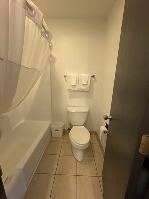 Suite, 1 King Bed, Refrigerator | Bathroom | Combined shower/tub, free toiletries, towels