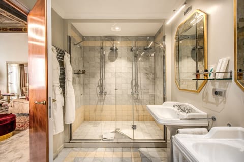 Presidential Suite | Bathroom | Designer toiletries, hair dryer, bathrobes, slippers