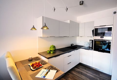 Apartment (F410) | Private kitchenette | Fridge, microwave, oven, stovetop