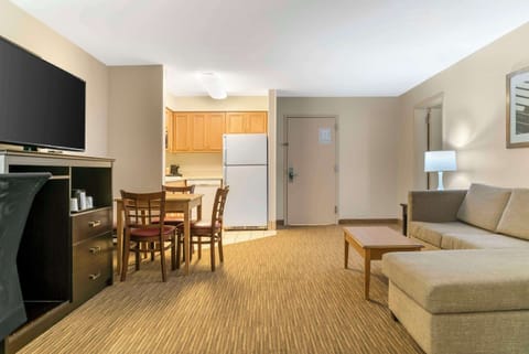 Suite, Multiple Beds, Non Smoking | Desk, laptop workspace, blackout drapes, iron/ironing board