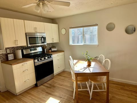 fully stocked kitchen with a dishwasher, microwave and disposal.