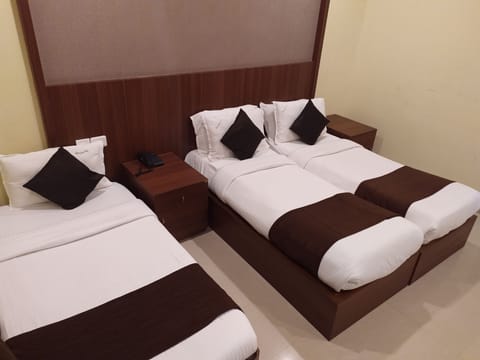 Deluxe Triple Room, 1 Bedroom, City View | 1 bedroom, Egyptian cotton sheets, premium bedding, down comforters