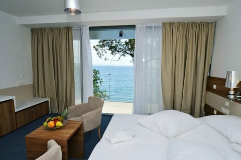 Deluxe Double or Twin Room, Sea View | Minibar, in-room safe, desk, iron/ironing board