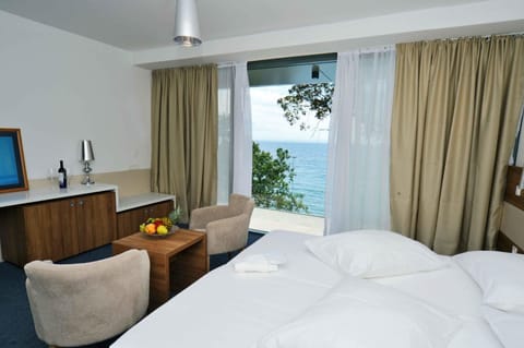 Deluxe Double or Twin Room, Sea View | Minibar, in-room safe, desk, iron/ironing board