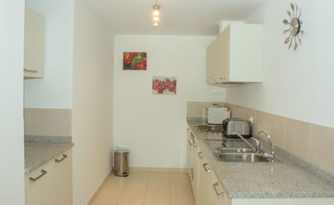 Apartment, 2 Bedrooms, Pool View | Private kitchenette | Full-size fridge, microwave, oven, stovetop