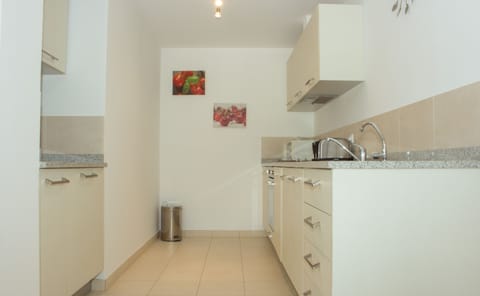 Apartment, 2 Bedrooms, Pool View | Private kitchenette | Full-size fridge, microwave, oven, stovetop