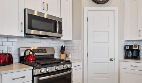 Top of the line appliances featuring a tea kettle