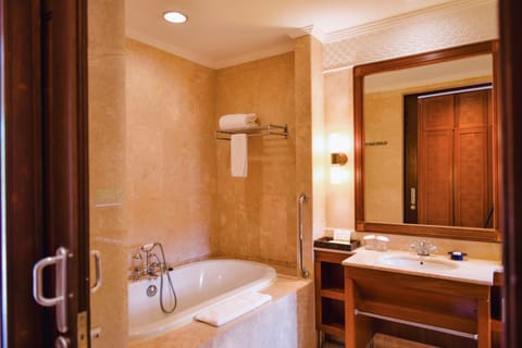 Separate tub and shower, hair dryer, bathrobes, slippers