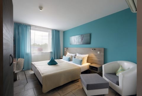 Double Room | Minibar, in-room safe, desk, cribs/infant beds