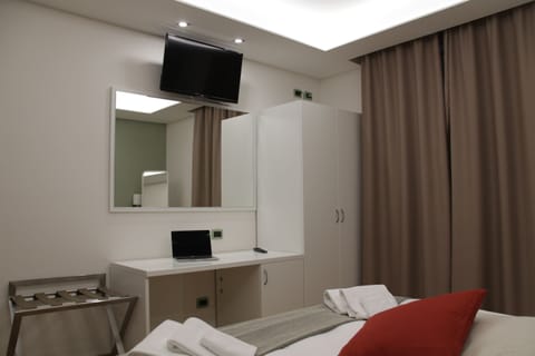 Double or Twin Room | Minibar, in-room safe, desk, rollaway beds