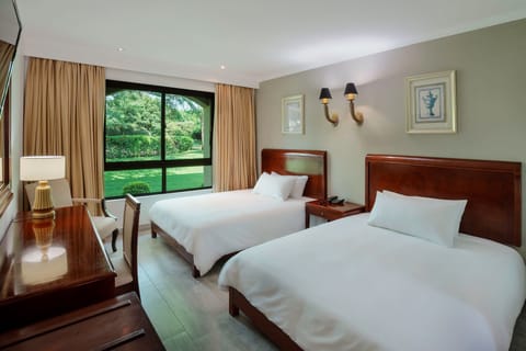 Room, 2 Queen Beds, Garden View | Down comforters, in-room safe, desk, blackout drapes