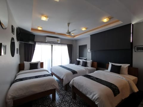 Deluxe Quadruple Room, City View | Free WiFi, bed sheets