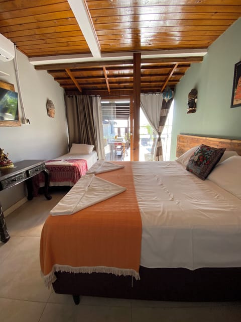 Deluxe Triple Room, Ocean View, Poolside | Minibar, iron/ironing board, free WiFi, bed sheets