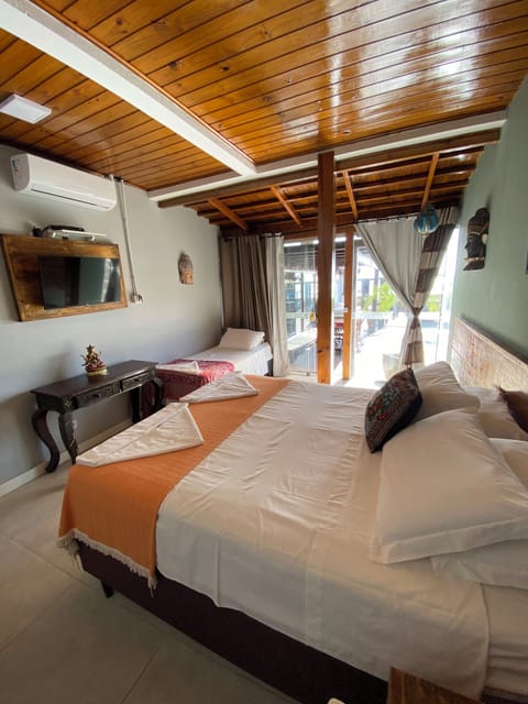 Deluxe Triple Room, Ocean View, Poolside | Minibar, iron/ironing board, free WiFi, bed sheets