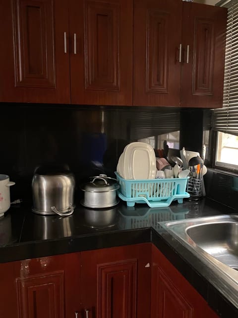 Full-size fridge, rice cooker, cookware/dishes/utensils, dining tables
