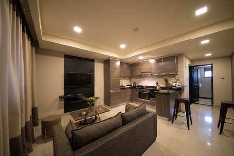 One Bedroom Suite | Living area | Flat-screen TV