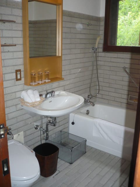 Two Bed Room Suite with Veranda | Bathroom | Combined shower/tub, deep soaking tub, free toiletries, hair dryer