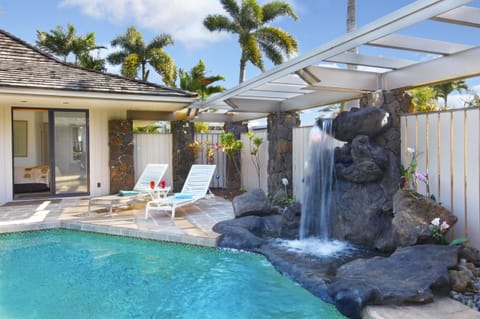 Beautiful private Hawaiian waterfall and pool, with seating and lounging room for all!