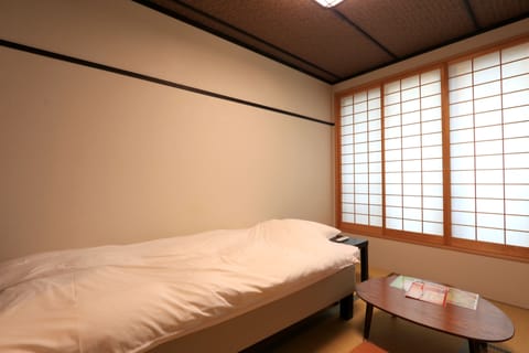 Standard Triple Room, Non Smoking | In-room safe, desk, blackout drapes, free WiFi