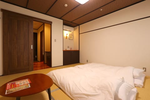 Standard Triple Room, Non Smoking | In-room safe, desk, blackout drapes, free WiFi