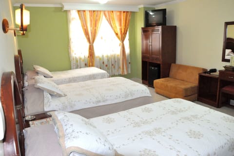 Triple Room, Multiple Beds | Minibar, in-room safe, desk, iron/ironing board