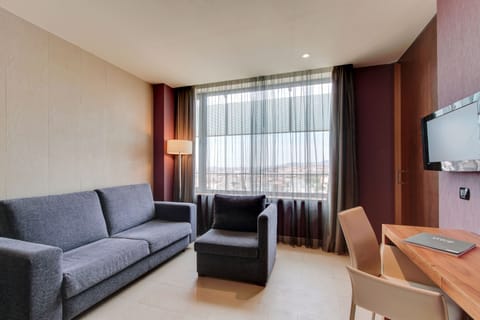 Junior Suite | Living room | Flat-screen TV