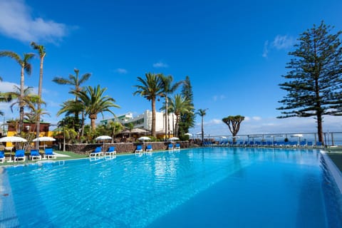 Indoor pool, outdoor pool, pool umbrellas, sun loungers