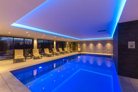 Indoor pool, open 9:00 AM to 8:00 PM, pool umbrellas, sun loungers